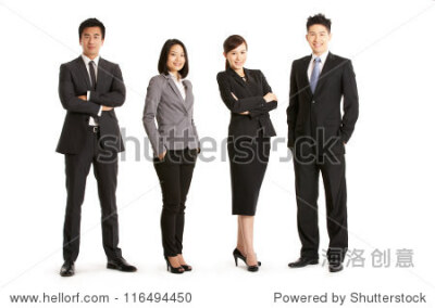 Full Length Studio Portrait Of Chinese Business Team