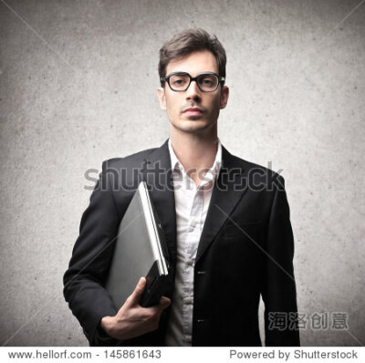 serious businessman with glasses and laptop