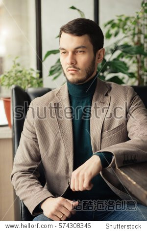 Confident businessman portrait in a cafe