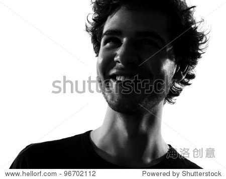 young man looking up portrait silhouette in studio isolated on white background