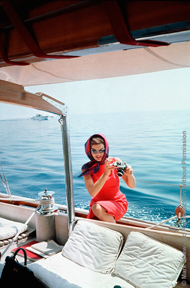 Jackie Taking a Picture Using Mark's Camera. Jackie in Ravello, Italy as photographed by Mark Shaw on a private cruise, summer of 1962 The source for this image was a vintage 35mm color transparency.