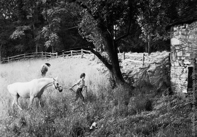 Shot for LIFE in 1959, Jackie Kennedy leads Sagebrush across a meadow at Merrywood, her mother's Virginia Estate. This image is also part of the Mark Shaw Photographic Archive's fine art gallery colle…