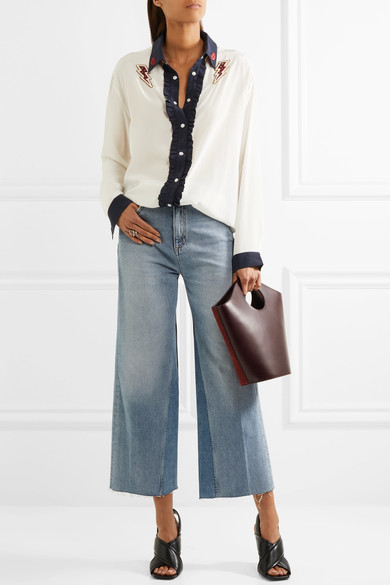 M.i.h Jeans 让经典 1970 年代风格牛仔裤重获时尚生机的能力让人不得不崇拜。这款 “Caron” 阔腿裤由挺括的蓝色牛仔布制成，采用舒适的高腰设计。从大热的穆勒鞋到舒适的拖鞋，及踝磨边裤脚与任何单品都搭配得宜。