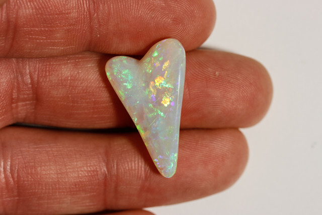 16.65 carat Mintabie Heart cut opal, orange green fire.