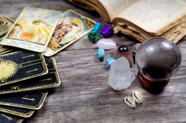 Fortune-telling tools on wooden table