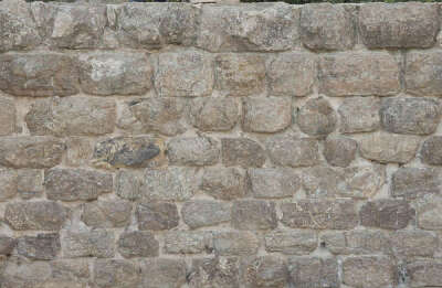 old wall bricks irregular stones rounded