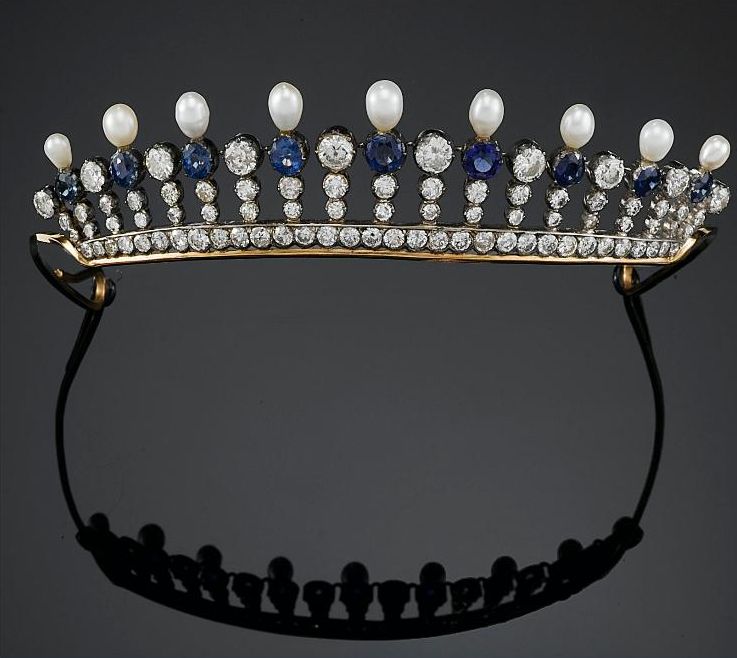 A diamond, sapphire and pearl tiara, possibly originating in Hannover, 1905. Designed as a diamond base set in gold, with diamond pinnacles alternating with diamond, sapphire and pearl pinnacles. 