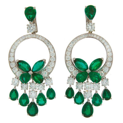 Stunning dressy dangle earrings created by Laurence Graff. Feature marquise and pear shape emeralds and round brilliant cut diamonds set in 18k white gold. Total weight of the emeralds is 20.42 carats…