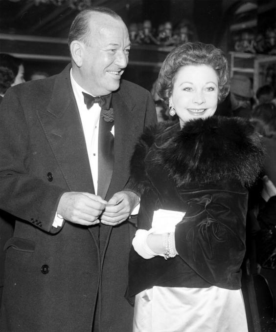 Noel Coward who is celebrating his 59th birthday arrives with Vivien for the first night of Who's your Father at the Cambridge Theatre London in 1958