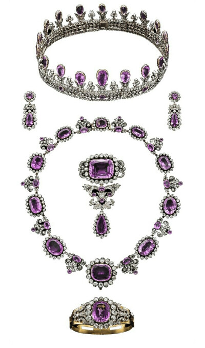 Prussia - The House of Hohenzollern Royal Pink Topaz Parure, Early 19th Century. Consisting of a tiara, a pair of pendant earrings, a necklace, a stomacher and a hinged bangle, all composed of gold, s…