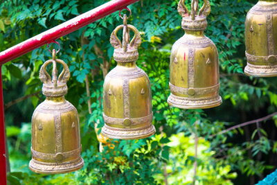 Golden bells hanging Buddhist temples in Thailand.