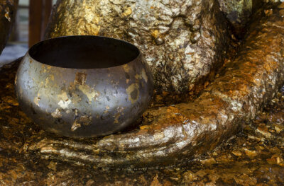 Golden alms bowl of the buddha statue