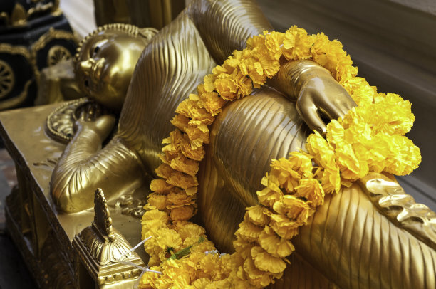 Lying Buddha with garland of flowers, Chiang Mai, Thailand