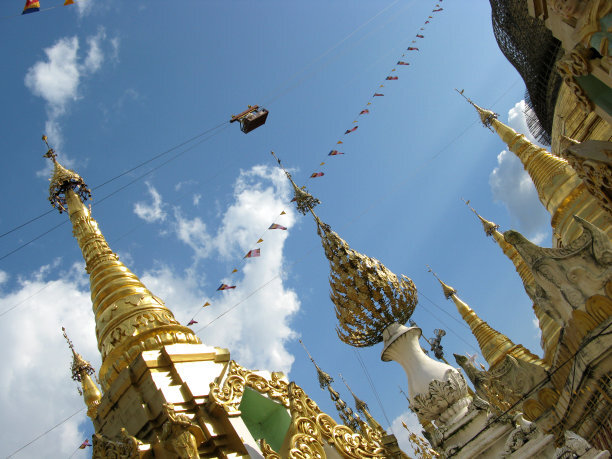 Second height pagodas of Shwedagon Pagoda against clear blue sky, Yangon, Myanmar