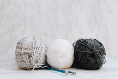 Gray Yarn and Knitting Needles