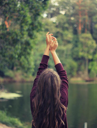 Woman holding up arms