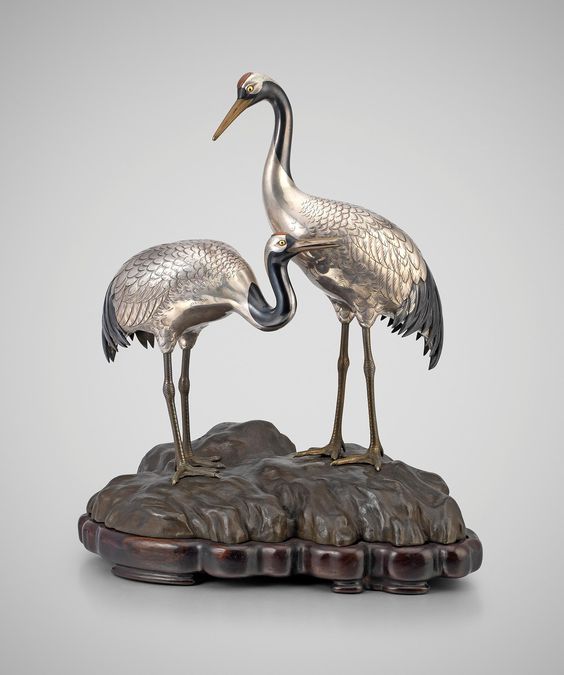 Yamakawa Kōji II (1860-1930) A Japanese study of silver cranes on a rock by Yamakawa Koji, Circa 1910 Okimono of a Pair of Cranes