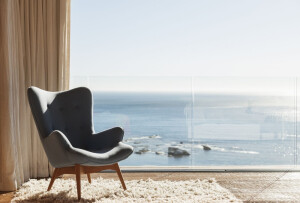 Chair in sunny window overlooking ocean by Caia Images on 500px