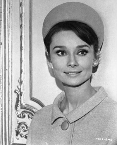 The actress Audrey Hepburn photographed by Vincent Rosell in an apartment rented for the filming of a scene from “Charade" in Paris (France), in January 1963.