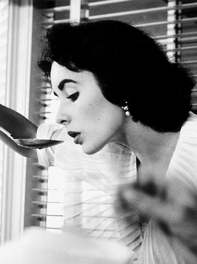 Elizabeth Taylor at a baby shower she helped give for Marilyn Hilton, 1950