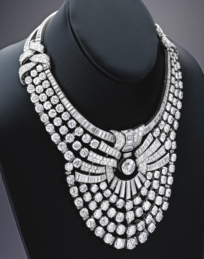 Another view of Queen Nazli’s necklace by Van Cleef & Arpels. A large part of Nazli’s jewelry collection, including her Van Cleef & Arpels diamond necklace and tiara, was sold by Sotheby Parke Bernet in New York in November 1975. The diamond necklace has since remained in a private collectio