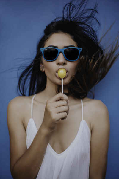 Woman Holding Lollipop