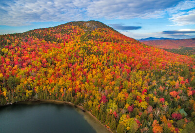 Aerial view of fall colors at peak in the Adirondack Mountains