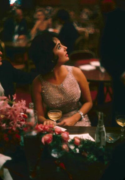 Elizabeth Taylor and her husband Eddie Fisher at the Louis Sherry bar and restaurant at the Metropolitan Opera House opening in New York City, 1959. 
(Photos by Yale Joel/The LIFE PictureCollection)…