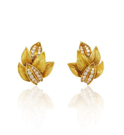 A pair of gold and diamond earrings in the form of textured overlapping leaves, in 18K gold. Van Cleef &amp; Arpels, France. #B3885. Atw 1.50cts...