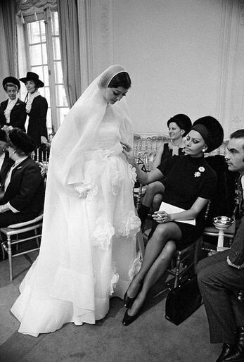 janina vinitskaya saved to wedding gowns,dresses, through the ages sophia loren admiring a christian dior wedding gown. (paris, 1968) jαɢlαdy 