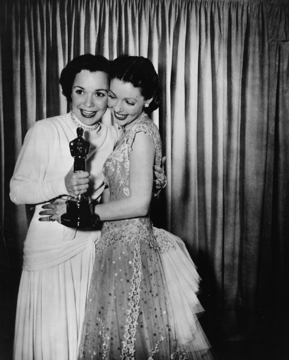 Loretta Young congratulating Jane Wyman, winner of Best Actress for Johnny Belinda, at the 21st Academy Awards in Hollywood on March 24, 1949 ​​​