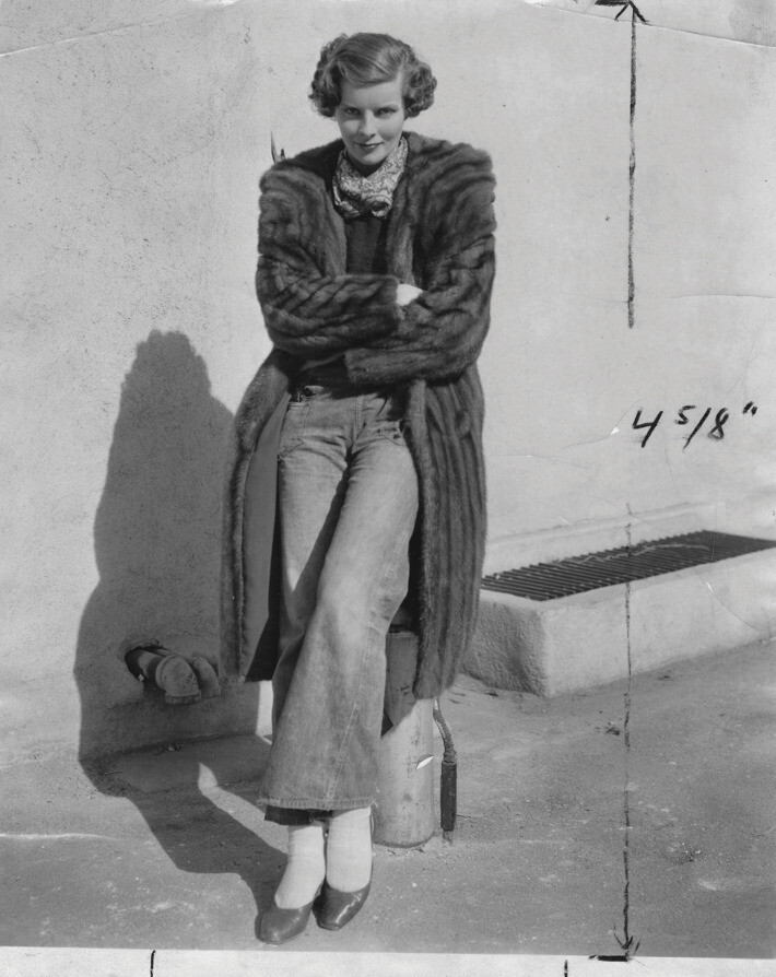 Circa 1932
Katharine Hepburn wearing dungarees on the RKO lot.