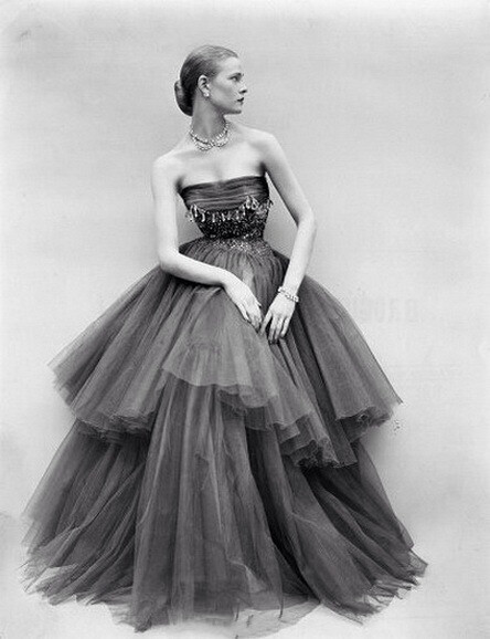 Susan Abraham wearing a beaded chiffon and tulle tiered evening gown, 1950s. Photo by Don Honeyman. ​​​