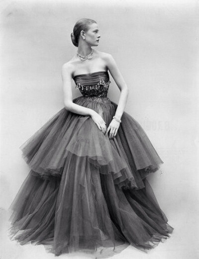 Susan Abraham wearing a beaded chiffon and tulle tiered evening gown, 1950s. Photo by Don Honeyman. ​​​