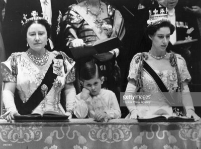 Queen Elizabeth Queen Mother and Prince Charles with Princess Margaret Rose (1930 - 2002) in the royal box at Westminster Abbey watching the Coronation ceremony of Queen Elizabeth II. ​