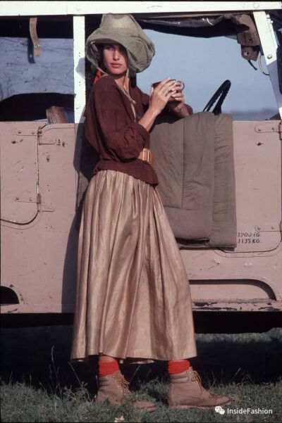 Albert Watson, July 1982 Model Andie MacDowell wears dark brown collarless suede shirt and light brown glazed linen skirt.